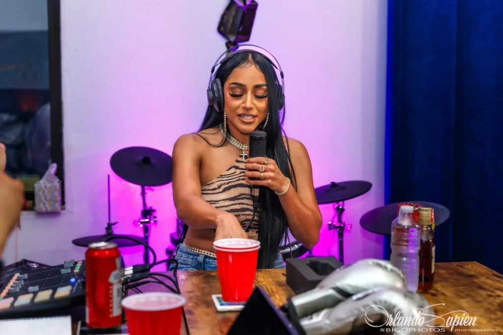 Guest holding the microphone on The TakeOver Show